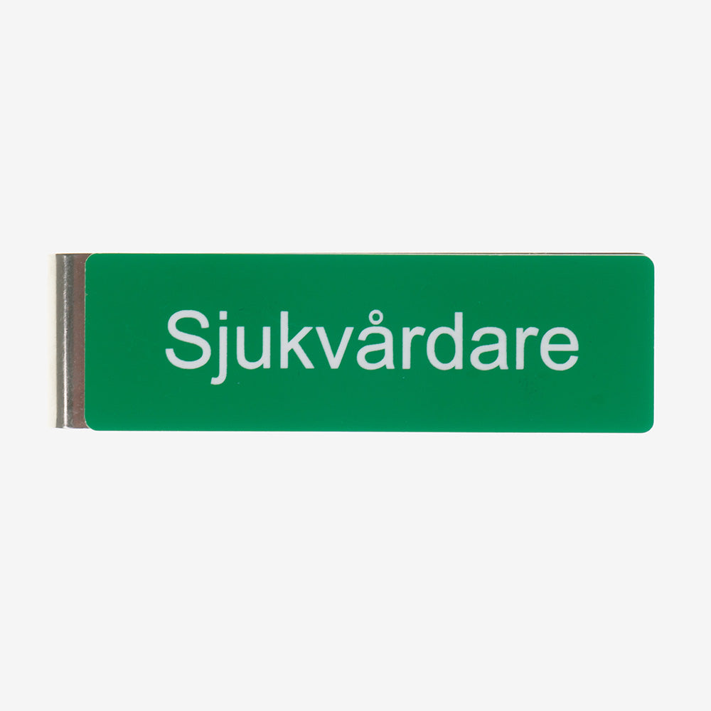 Tunnistemerkki sotilasklipsillä lääkintämies