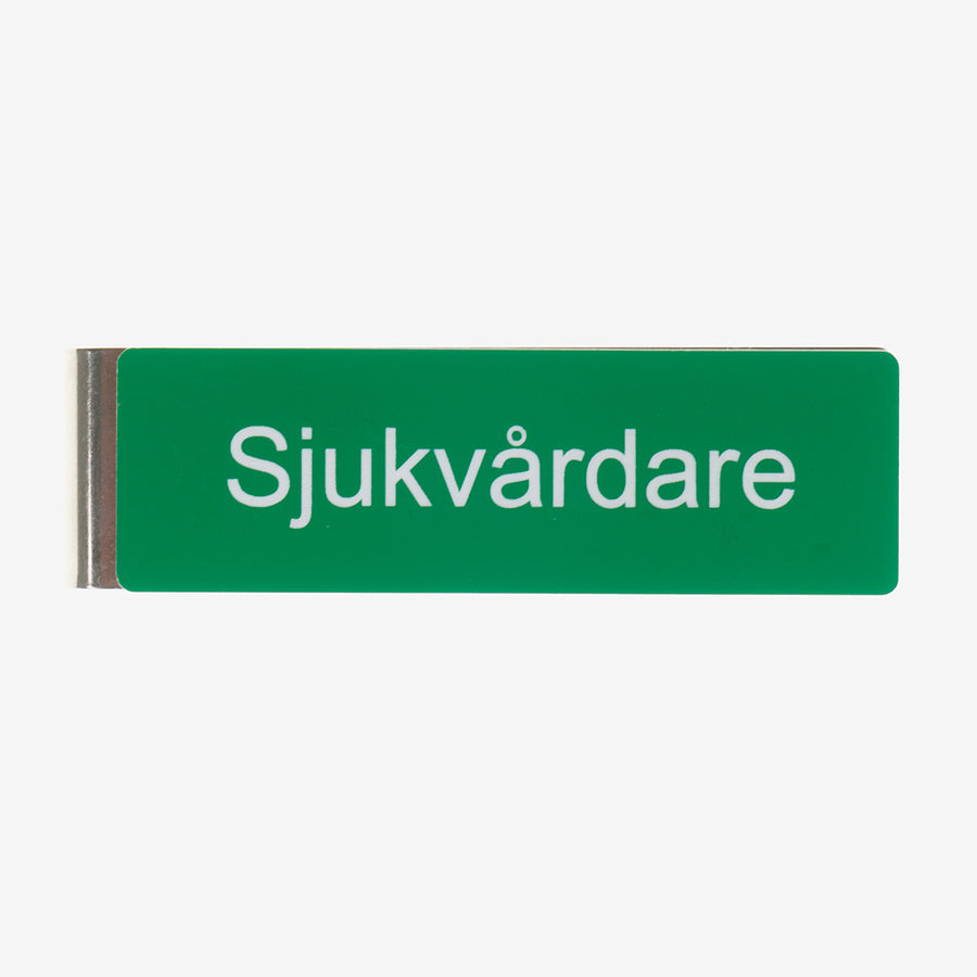 Tunnistemerkki sotilasklipsillä lääkintämies